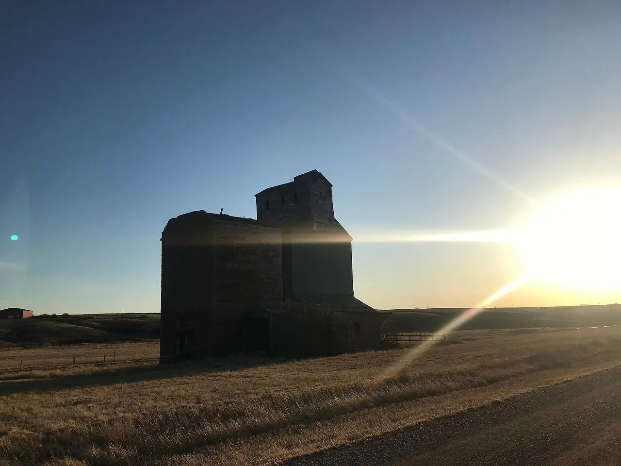 Old grain elevator at sunset near Brooking, 2020